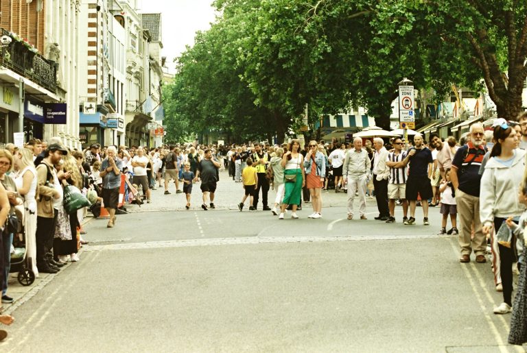 A crowd lining a street