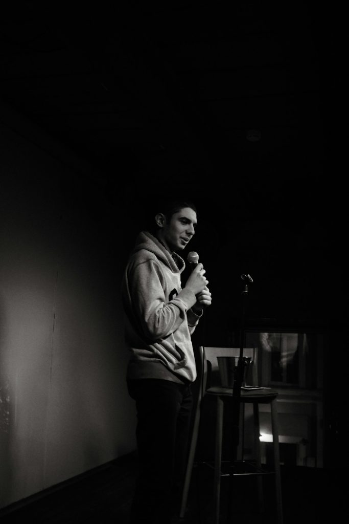 A comedian on stage at a club